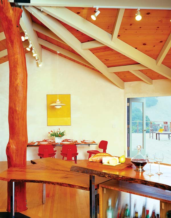 
The large, open great room leads to an elevated deck above the home's 10,000-gallon rainwater storage tank.
